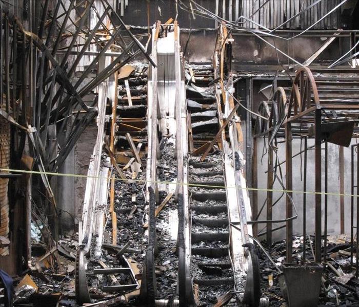 Fire and soot damage to a set of escalator.  
